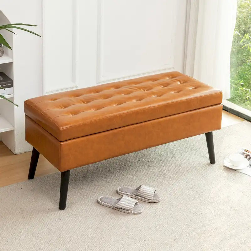 Banco de almacenamiento de cuero acolchado con patas de madera maciza