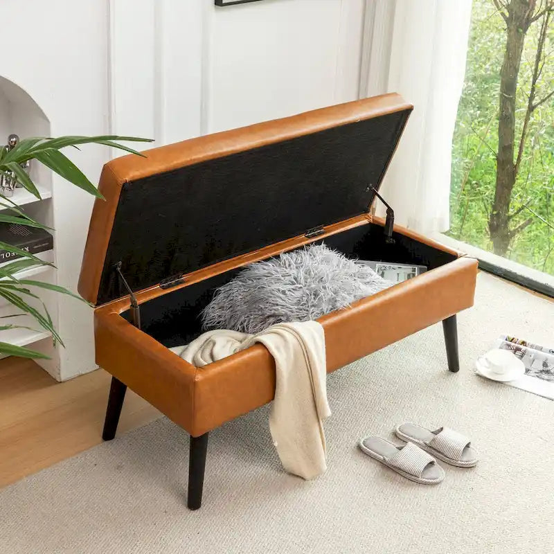 Banco de almacenamiento de cuero acolchado con patas de madera maciza