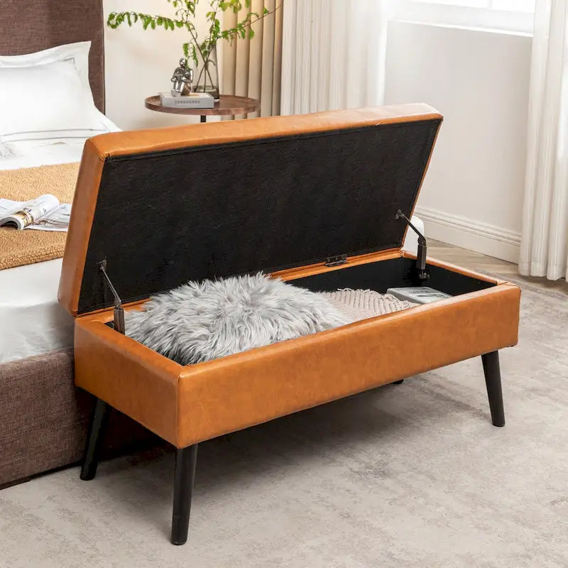 Banco de almacenamiento de cuero acolchado con patas de madera maciza